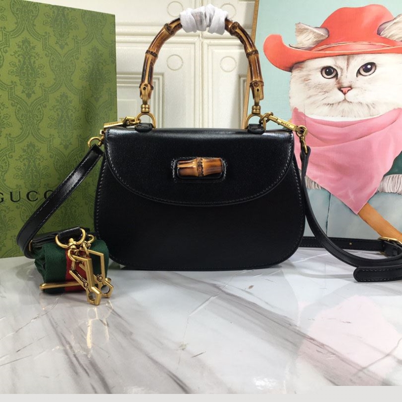 G*u*i top handle bags